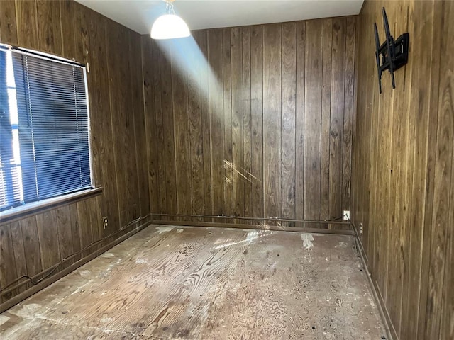 empty room with wood walls