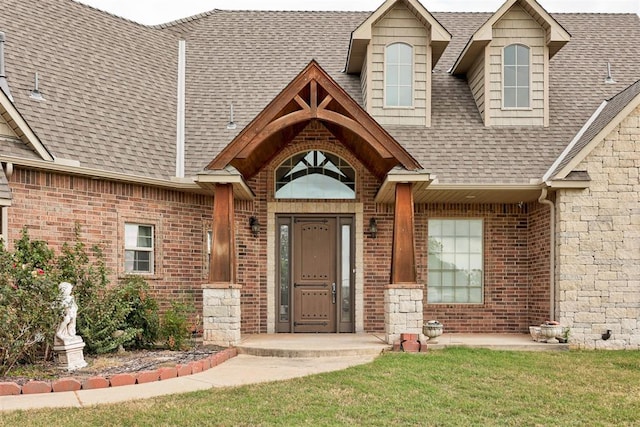 doorway to property with a yard