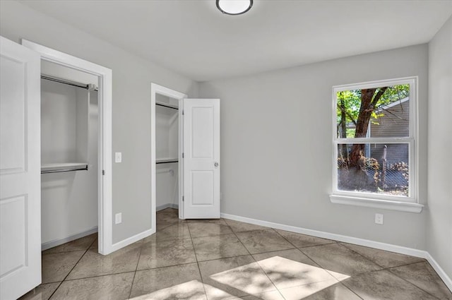 unfurnished bedroom with light tile patterned floors