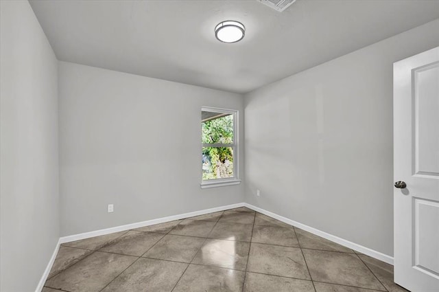 spare room with tile patterned flooring