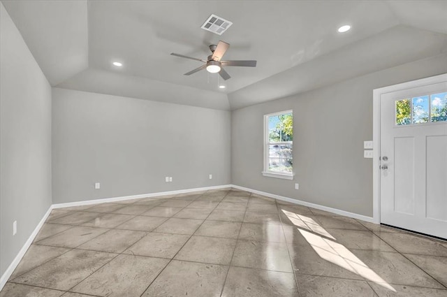 entrance foyer featuring ceiling fan, a healthy amount of sunlight, and lofted ceiling