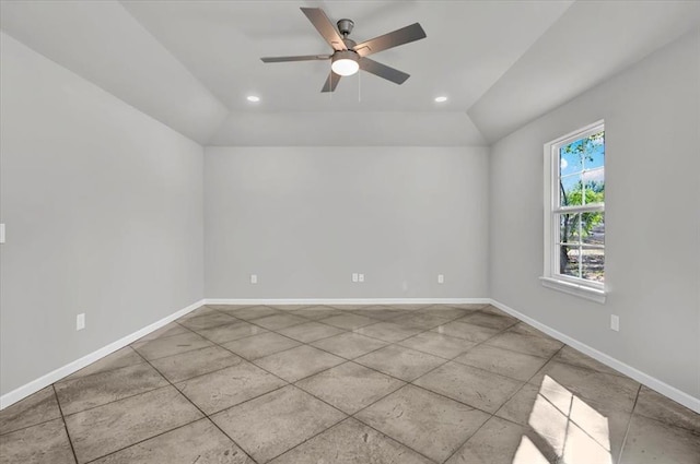 empty room with ceiling fan and lofted ceiling