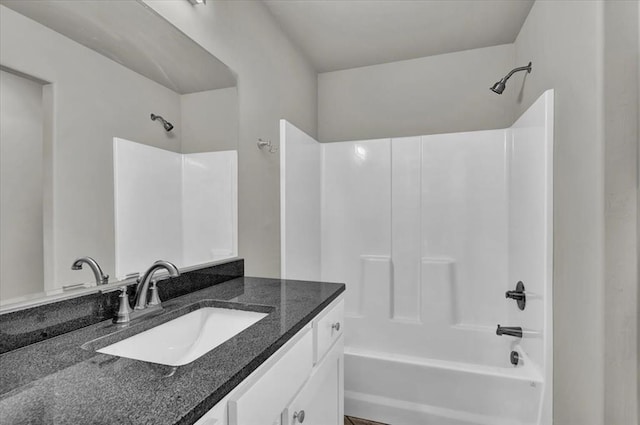 bathroom featuring vanity and shower / tub combination