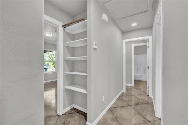 hallway featuring light tile patterned flooring