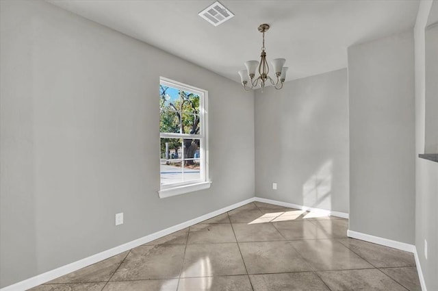 1200 N Lloyd Dr, Oklahoma City, OK 73130 - spare room featuring a chandelier and baseboards