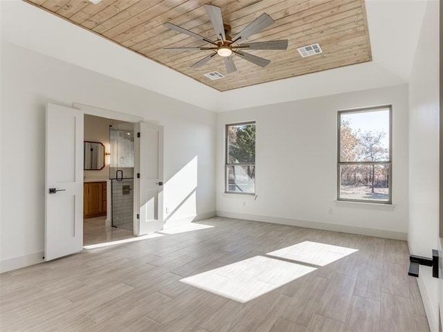 unfurnished room with light wood-type flooring, a skylight, ceiling fan, and wooden ceiling