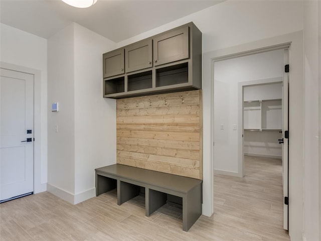 mudroom with light hardwood / wood-style floors