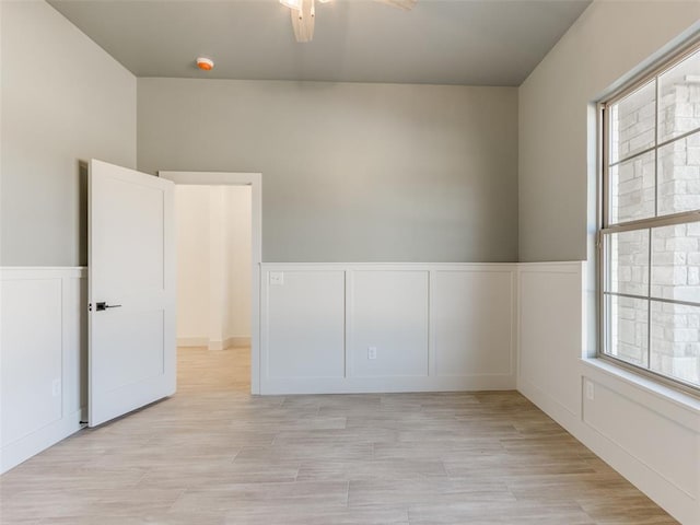 spare room featuring light hardwood / wood-style floors