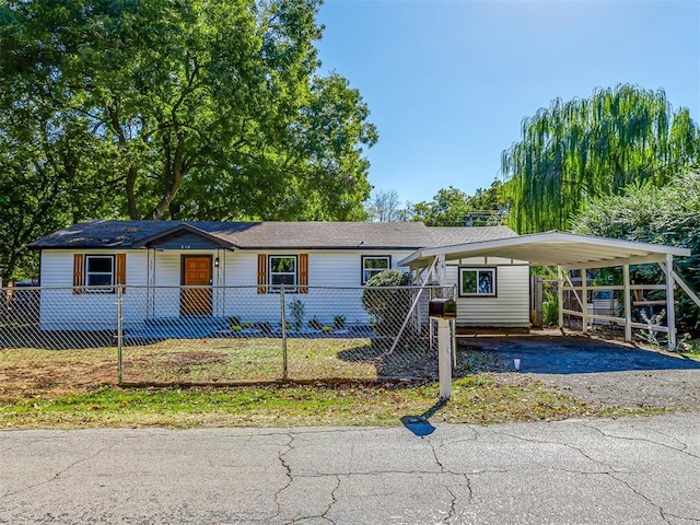 ranch-style home featuring a carport