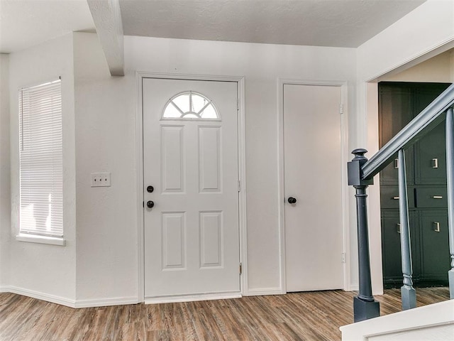 foyer with hardwood / wood-style floors