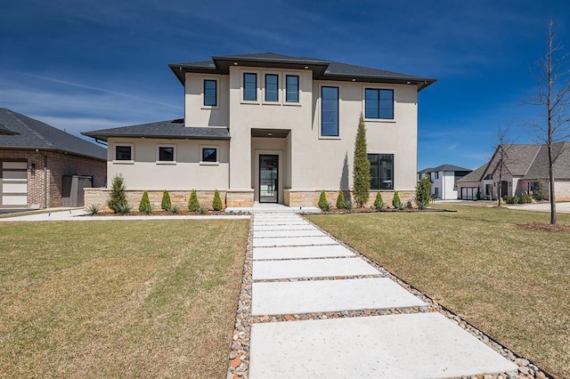 2009 Wiregrass Dr, Edmond, OK 73025 - prairie-style home featuring stucco siding, stone siding, a front yard, and a shingled roof