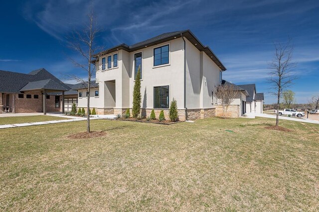 2009 Wiregrass Dr, Edmond, OK 73025 - contemporary home with stone siding, stucco siding, and a front lawn
