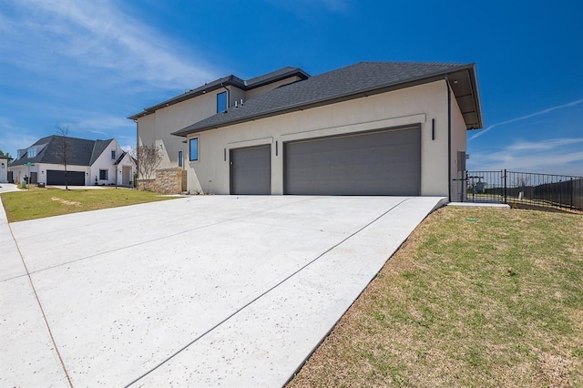 view of property exterior featuring a lawn and a garage