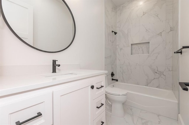 full bathroom featuring toilet, vanity, and tiled shower / bath