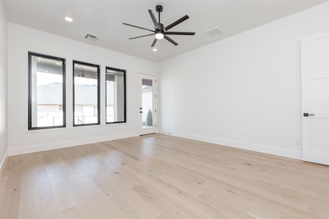 spare room with ceiling fan and light hardwood / wood-style flooring