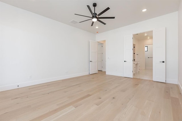 unfurnished room featuring ceiling fan and light wood-type flooring