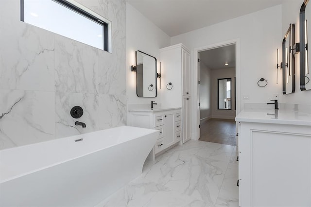 bathroom with a bathtub and vanity