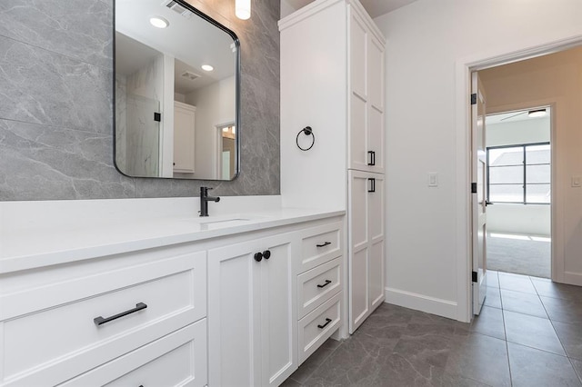 2009 Wiregrass Dr, Edmond, OK 73025 - bathroom with vanity and baseboards