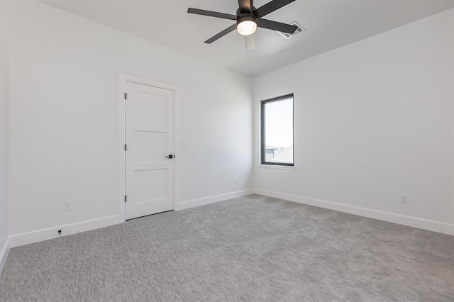 unfurnished room featuring carpet and ceiling fan