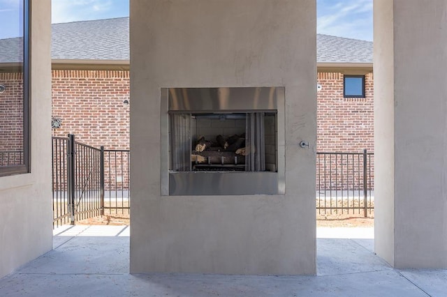 view of patio featuring exterior fireplace