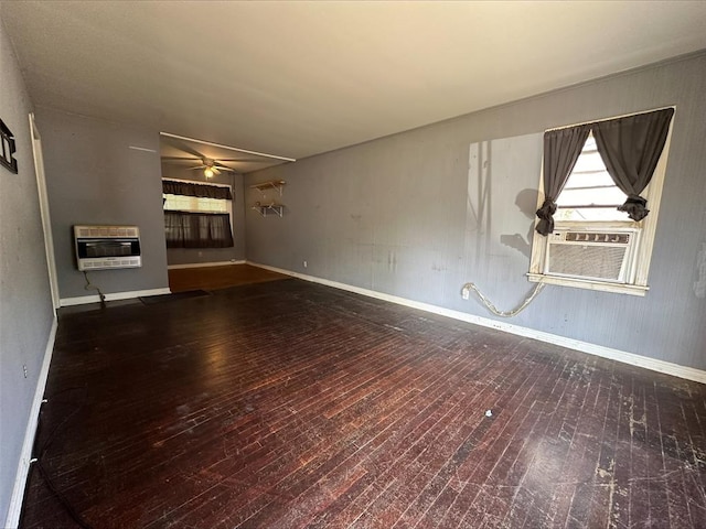 unfurnished living room featuring heating unit, ceiling fan, cooling unit, and hardwood / wood-style flooring