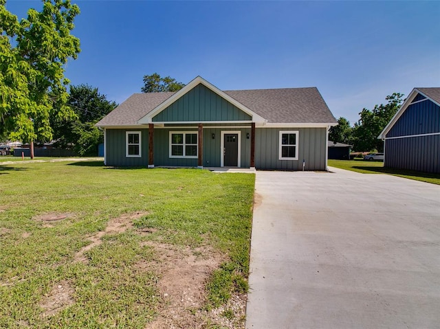 view of front facade with a front lawn and a porch