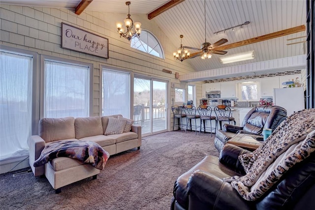 carpeted living room with beam ceiling, ceiling fan with notable chandelier, rail lighting, and high vaulted ceiling