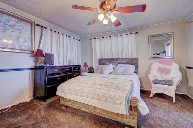 carpeted bedroom featuring a textured ceiling, ceiling fan, and ornamental molding