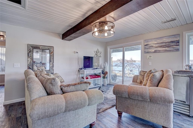 living room with beam ceiling, wooden ceiling, dark wood-type flooring, and a notable chandelier