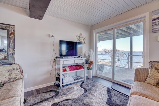 living room with wood-type flooring and wooden ceiling