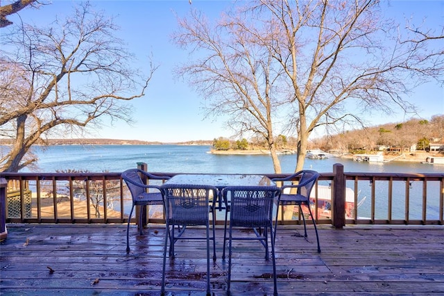 wooden terrace with a water view