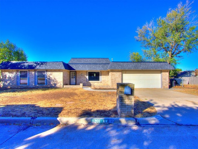 ranch-style house featuring a garage