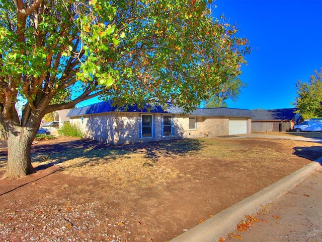 ranch-style home with a garage