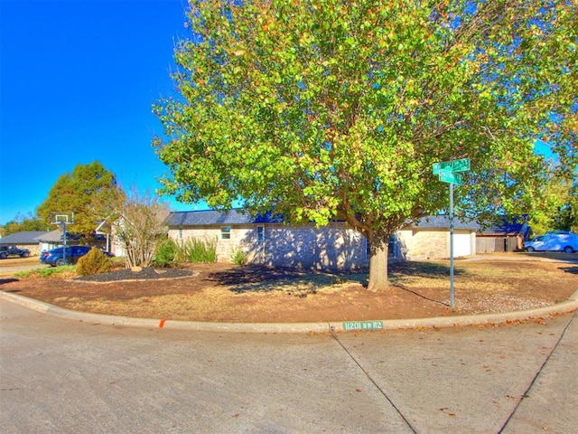 obstructed view of property featuring a garage