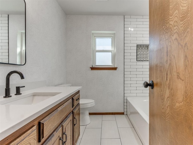 bathroom featuring toilet, vanity, and tile patterned floors