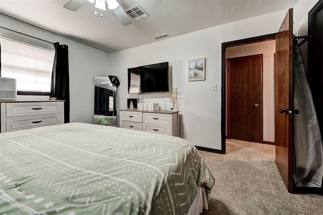 bedroom featuring ceiling fan and light carpet