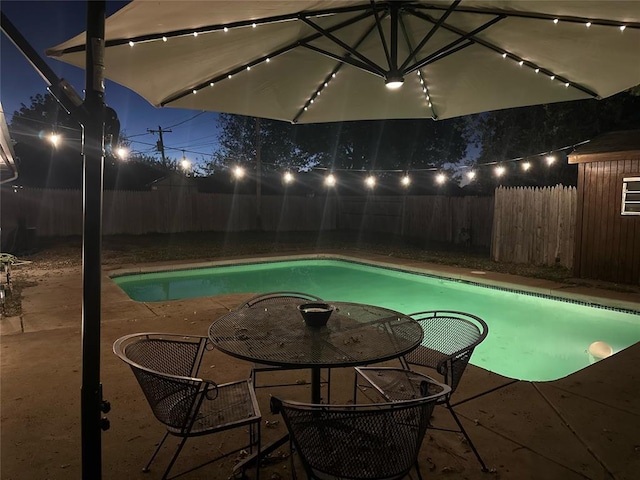 view of swimming pool with a patio area