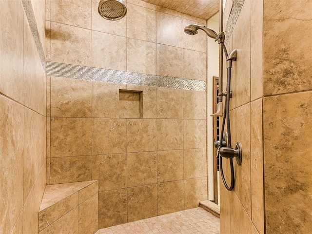 bathroom with a tile shower