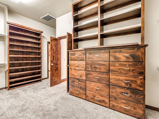 spacious closet featuring carpet and visible vents