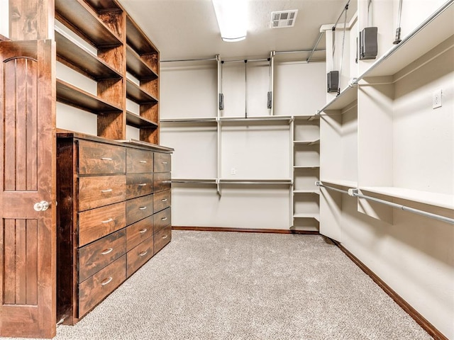 spacious closet with visible vents and carpet flooring