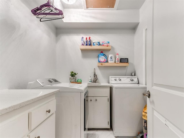 laundry area with sink and washing machine and clothes dryer