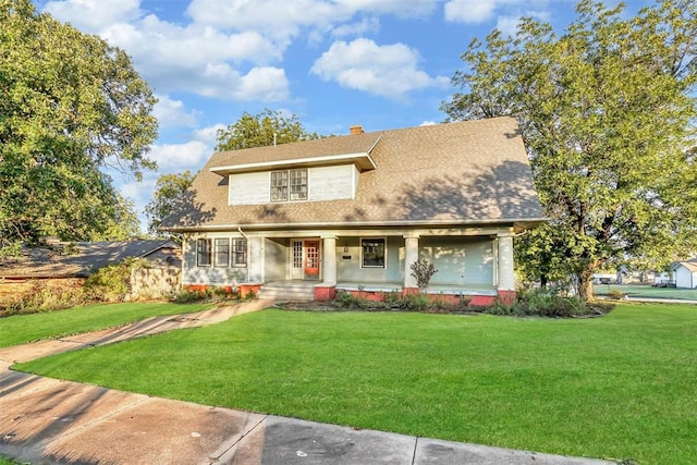 603 N College St, Cordell, OK 73632 - view of front of property with covered porch, a front lawn, and a chimney