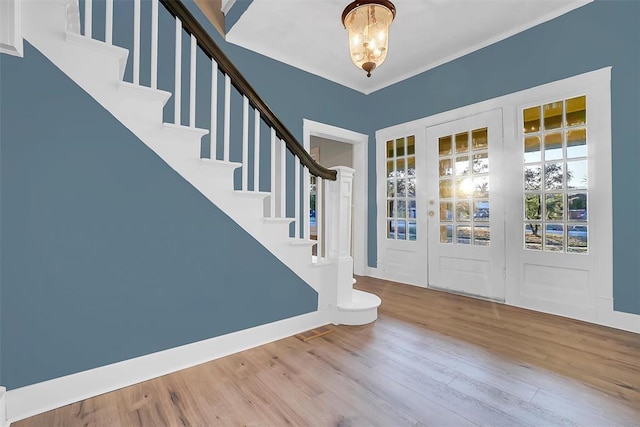 603 N College St, Cordell, OK 73632 - entrance foyer featuring a chandelier, wood finished floors, and stairs