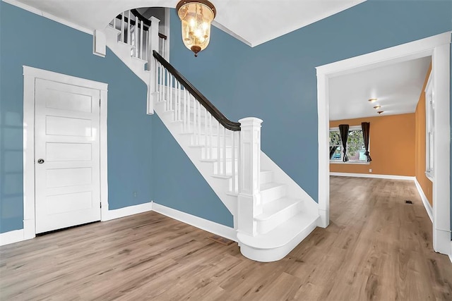 staircase with wood-type flooring