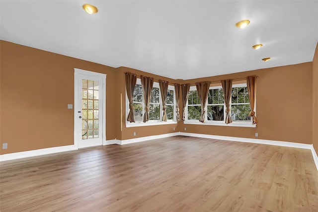 unfurnished living room featuring light hardwood / wood-style floors