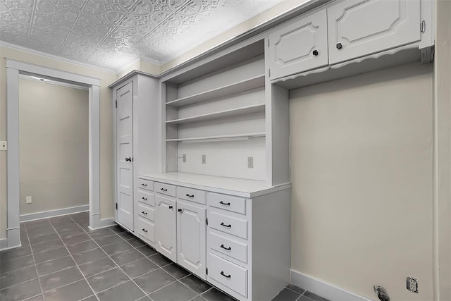 interior space featuring dark tile patterned floors