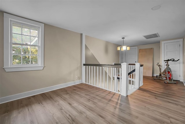 empty room with hardwood / wood-style flooring