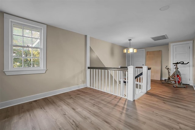 603 N College St, Cordell, OK 73632 - spare room featuring wood finished floors and baseboards