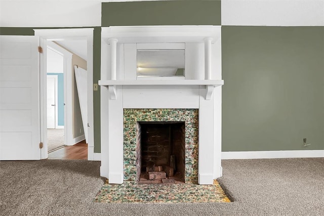 unfurnished living room featuring carpet flooring and a fireplace