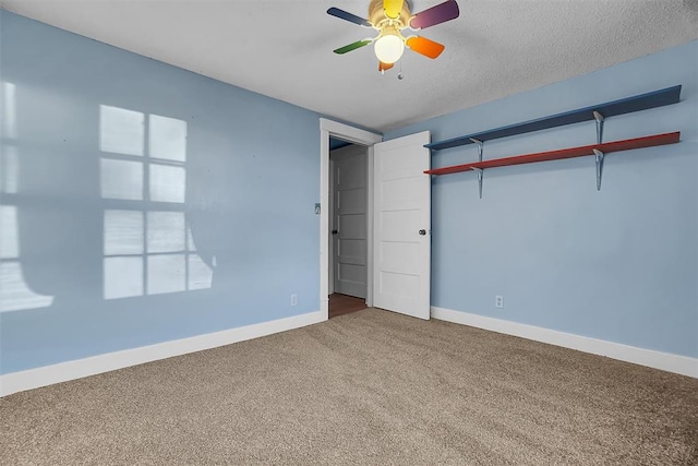 unfurnished bedroom with ceiling fan, a closet, carpet floors, and a textured ceiling